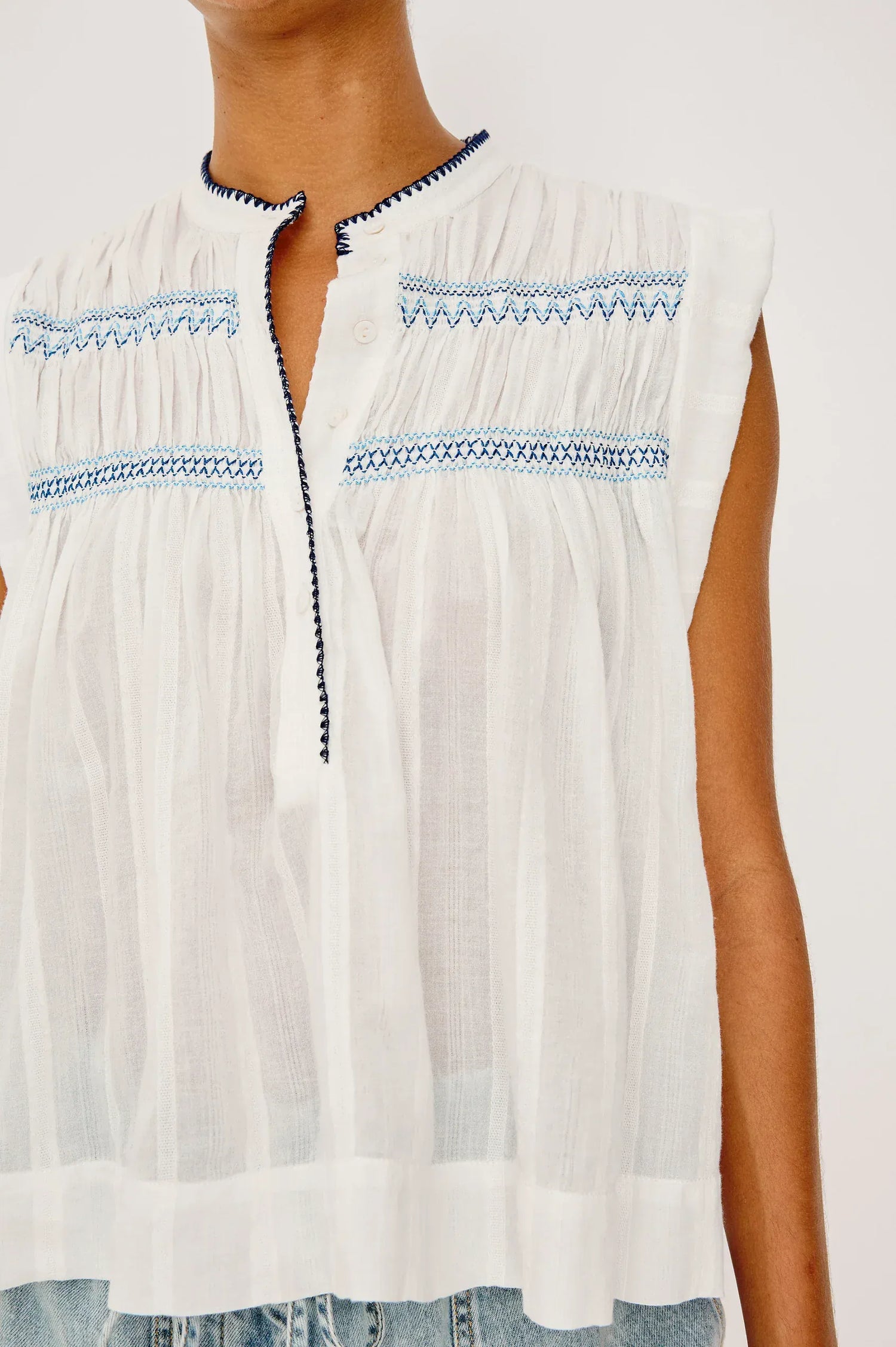 The Willow is a sleeveless trapeze-style top crafted from lightweight, subtly textured cotton. Effortless by design