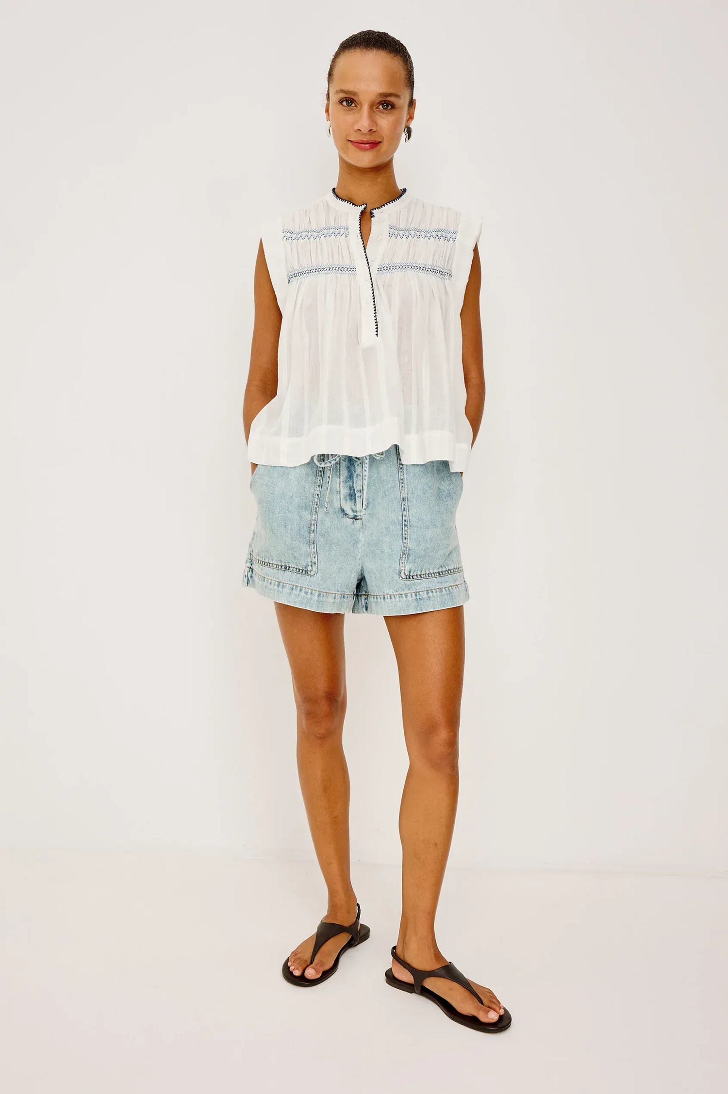 The Willow is a sleeveless trapeze-style top crafted from lightweight, subtly textured cotton. Effortless by design